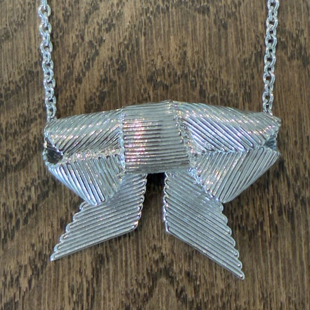Kate Spade All Wrapped Up Silver Tone Ribbed Grosgrain Ribbon Bow Necklace Charm